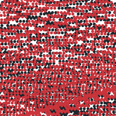 Obraz premium Black and red dots form a texture or screentone.