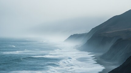 Misty coastal landscape with majestic cliffs and waves crashing on an overcast day, showcasing the...