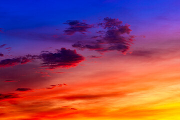 Beautiful colorful sky background in the morning with rising sun reflecting off the clouds creating a stunning and mesmerizing light effect.