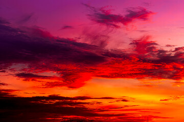 Beautiful colorful sky background in the morning with rising sun reflecting off the clouds creating a stunning and mesmerizing light effect.