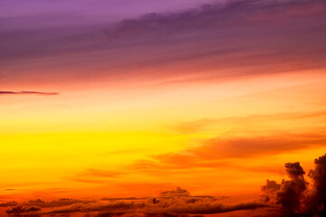 Beautiful colorful sky background in the morning with rising sun reflecting off the clouds creating a stunning and mesmerizing light effect.