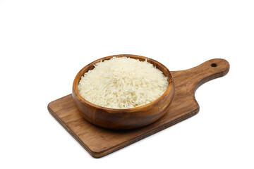 Raw white rice on wooden background. Long uncooked rice in wooden plate. Natural organic food. Traditional Asian cereal culture.	
