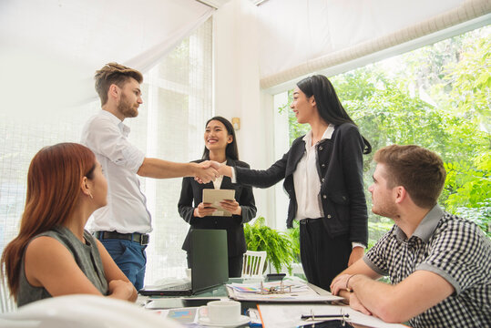 Top view of MultiEthnics Teamwork high five hands stack shakehand together. Collaboration Team Meeting in Conference Room. Diversity Partner Business Meeting brainstorm hand holding teamwork consult