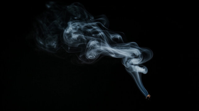 A small wisp of smoke against a black background
