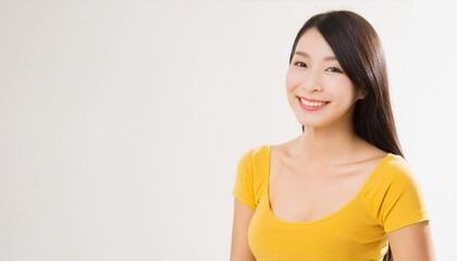 Fototapeta premium A portrait of an Asian woman wearing yellow clothing and smiling.
