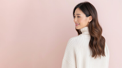 Indonesian woman in white sweater smile to copy space for text advertising