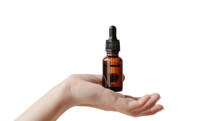Hand holding oil serum , dropper isolated on white background