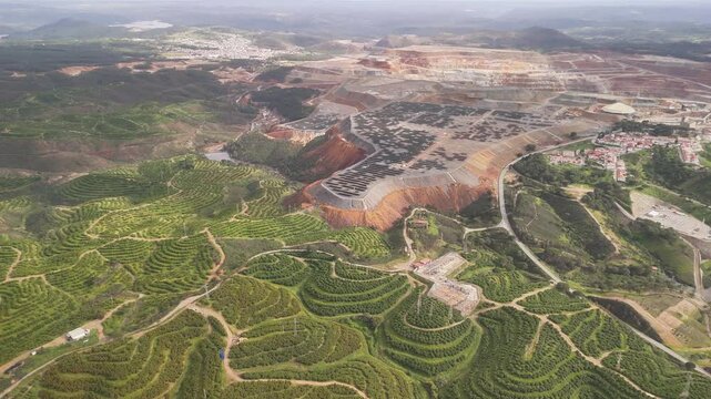 Aerial view of beautiful mining area and golf course surrounded by hills and valley, La Dehesa, Spain.
