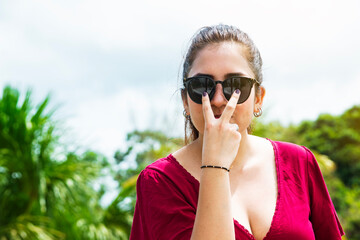 Latina girl with black glasses relaxing in Tarapoto - Peru