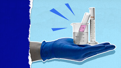 A person is holding a beaker with a liquid in it