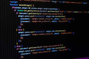 Software source code. Programming code. Programming code on computer screen. Developer working on...