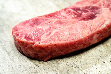 A piece of sirloin meat with a red center and a white spot
