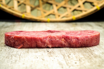 A piece of sirloin meat with a red center and a white spot