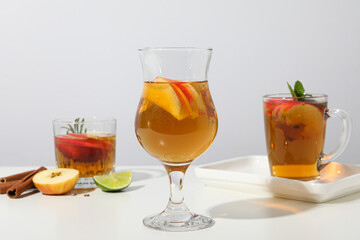 Glasses with apple cider on white background