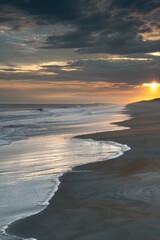 Obraz premium A rider and their horse enjoy the serene atmosphere of a beach at sunset