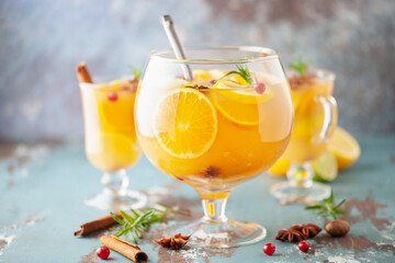 Homemade hot alcohol mulled apple cider punch with cinnamon sticks, anise star and spices