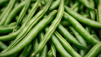 Obraz premium Closeup photograph showcasing the vibrant green color and slight shiny appearance of freshly harvested green beans This image highlights the natural beauty and texture of this healthy