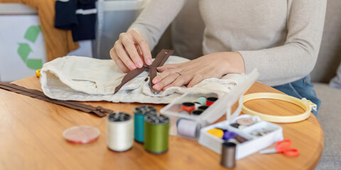 Sewing Enthusiast Fixing Zipper on Fabric. Home Crafting and Repair