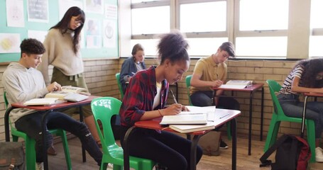 Classroom, portrait and students in high school, happy learning and writing notes for education or studying with teacher. Youth or African girl at her desk with books for language or history subject