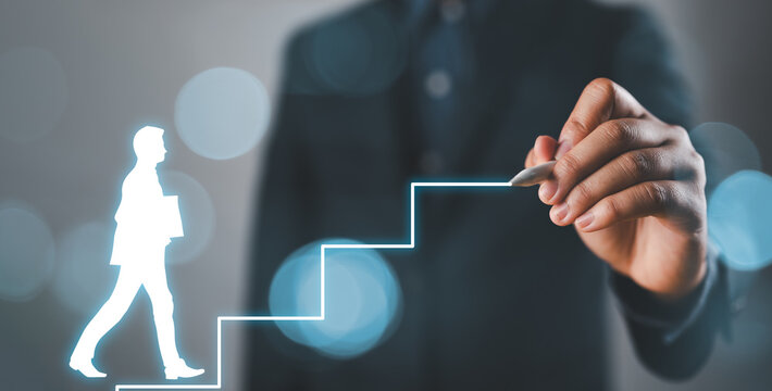 Personal development, career growth, success, progress and potential concepts. Human resources officer, supervisor help employee with his growth symbolized by stairs, bokeh background.