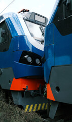 Close-up of blue and orange locomotive. Modern train engine detail, railway transportation, industrial design concept.