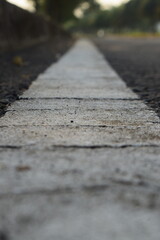 Photo of white road markings on asphalt