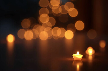 Softly glowing candles with a warm bokeh background creating a peaceful and serene ambiance