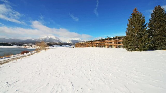 Frisco Colorado small town by Dillon Reservoir lake in cold winter, panning residential apartment waterfront buildings
