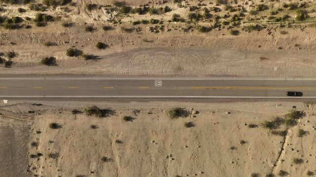 Aerial view of scenic Route 66 traversing through the vast desert landscape, Bagdad, United States.
