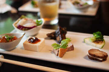 Delicious and beautiful appetizer with a variety of healthy ingredients at a fancy food restaurant in Japan. Fine dining in Tokyo.