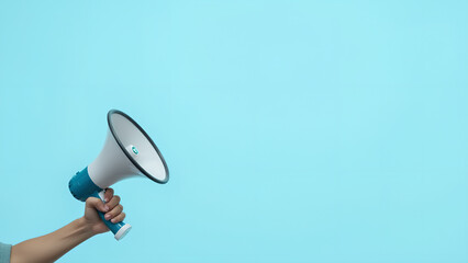 A hand holding a megaphone against a light blue background