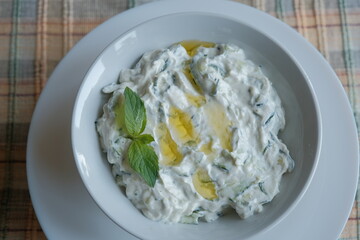 Tzatziki - Greek yogurt sauce. Traditional Tzatziki yoghurt sauce with cucumbers, olive oil and spices