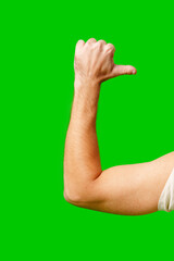 Hand Giving Thumbs Up Gesture Against Bright Green Background