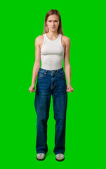 Young Woman Standing With Clenched Fists Against Green Screen Background