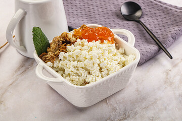 Curd with granola and orange jam