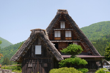 Gassho-zukuri, a special building located in Shirakawa Township, Japan. The Gasshō-style house is characterized by a steeply slanting thatched roof, resembling two hands joined in prayer.