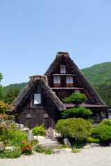Gassho-zukuri, a special building located in Shirakawa Township, Japan. The Gasshō-style house is characterized by a steeply slanting thatched roof, resembling two hands joined in prayer.