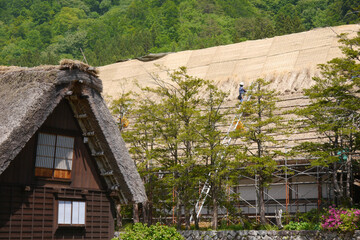 Gassho-zukuri, a special building located in Shirakawa Township, Japan. The Gasshō-style house is characterized by a steeply slanting thatched roof, resembling two hands joined in prayer.