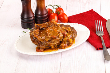 Italian cuisine - ossobuco with sauce