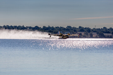 Amphibian aircraft loading water into the Valparaíso Reservoir to extinguish a fire. Valparaíso,...