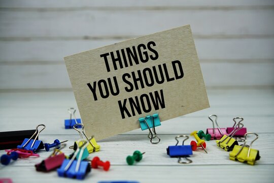 Things You Should Know text on paper card with stationary on wooden background