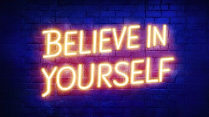 Obraz premium Bright neon sign with the motivational phrase 'BELIEVE IN YOURSELF' glowing against a dark brick wall.