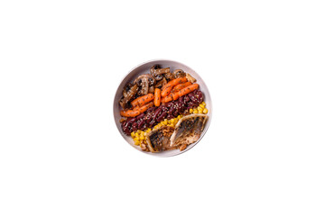 A colorful vegetarian dish consists of fish, beans, corn, mushrooms