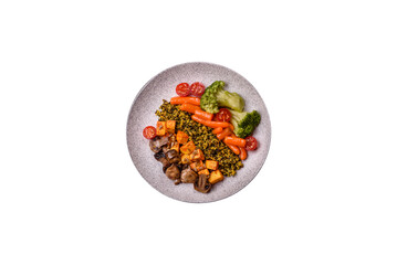 Colorful vegan vegetarian dish consists of tofu, broccoli, quinoa, mushrooms