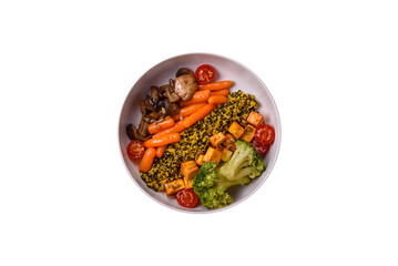 Colorful vegan vegetarian dish consists of tofu, broccoli, quinoa, mushrooms