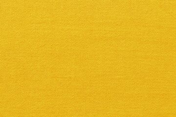 Yellow gold cotton fabric cloth texture for background, natural textile pattern.