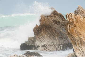 Heavy Waves Crashing on the white rock at new zealands coast