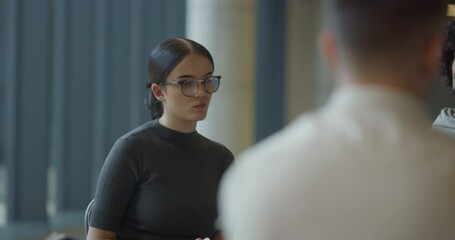 A diverse group of entrepreneurs engages in a dynamic business meeting within a modern office, showcasing their collaborative spirit and innovative approach to business development