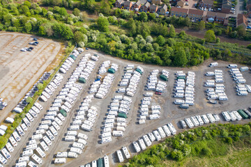 Aerial photo of a caravan storage yard located in the village of Castleford in Wakefield West Yorkshire in the UK showing rows of caravans and motorhomes surrounded by trees