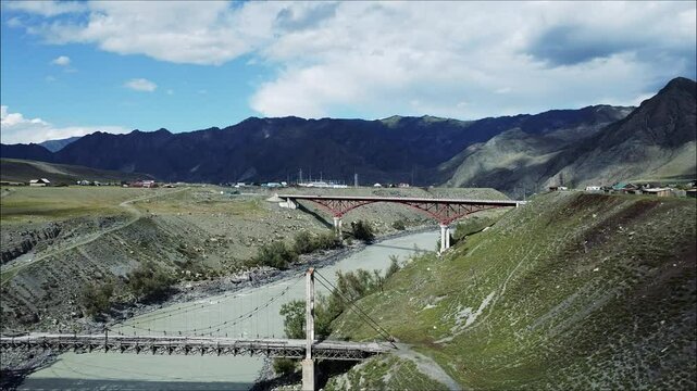 Landscapes and Bridge over the Katun River near Oroktoy settlement on the Chemal Tract in the Altai Mountains, Russia
